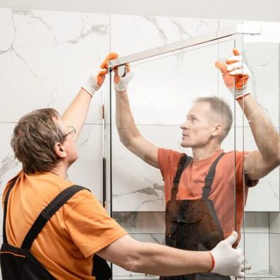 workers-are-installing-glass-door-shower-enclosure